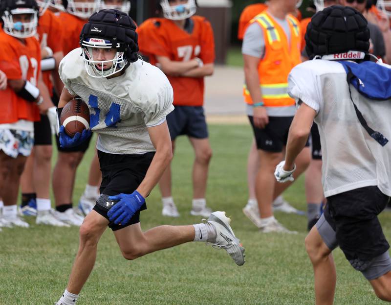 Genoa-Kingston’s Ben Kleba runs after a catch Tuesday, Aug. 19, 2025, during practice at the school.