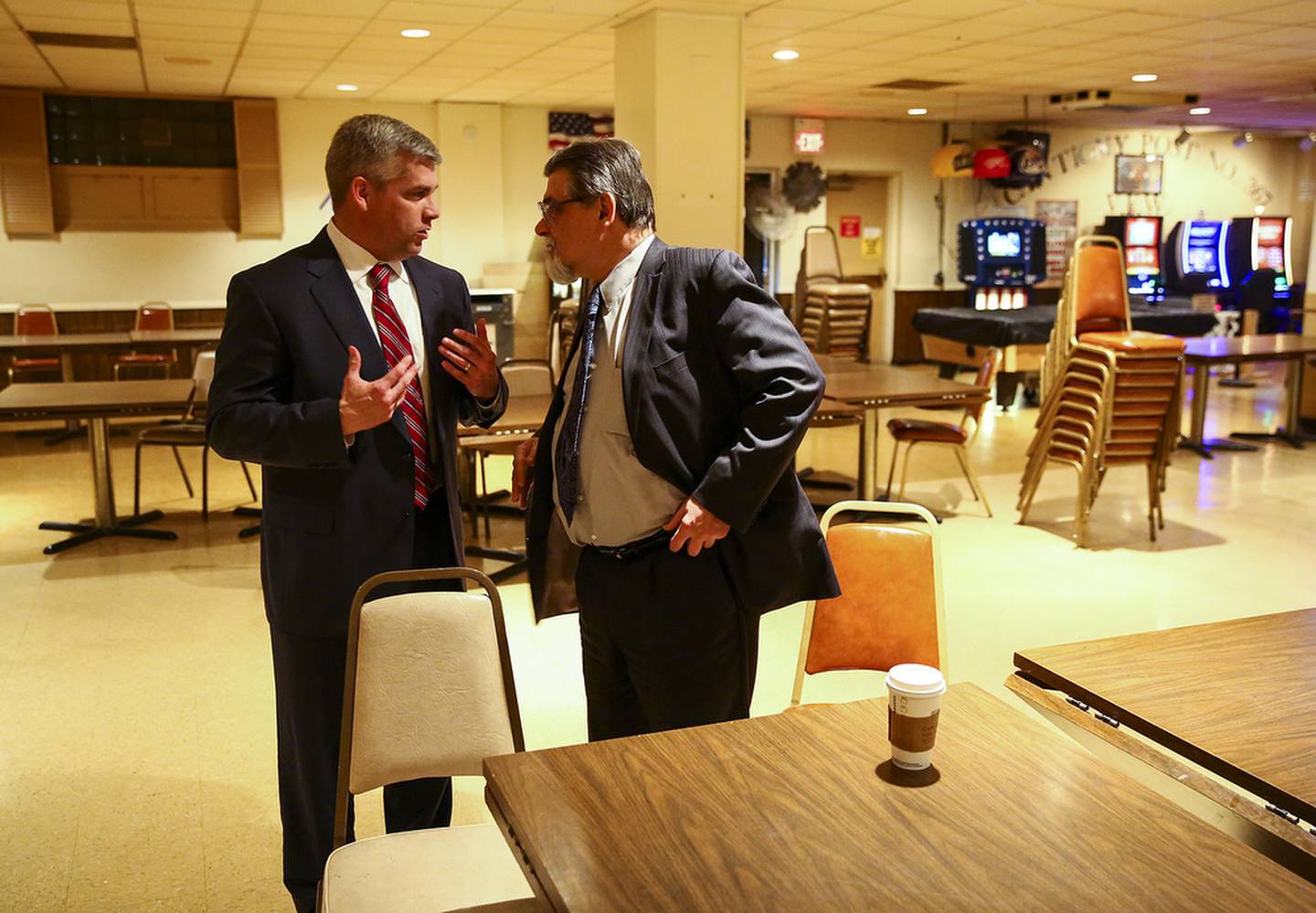 Mayor Elect Bob O'Dekirk speaks to Ken Zelazo while waiting for election results to come in on Tuesday April 7, 2015, in Joliet, Ill.