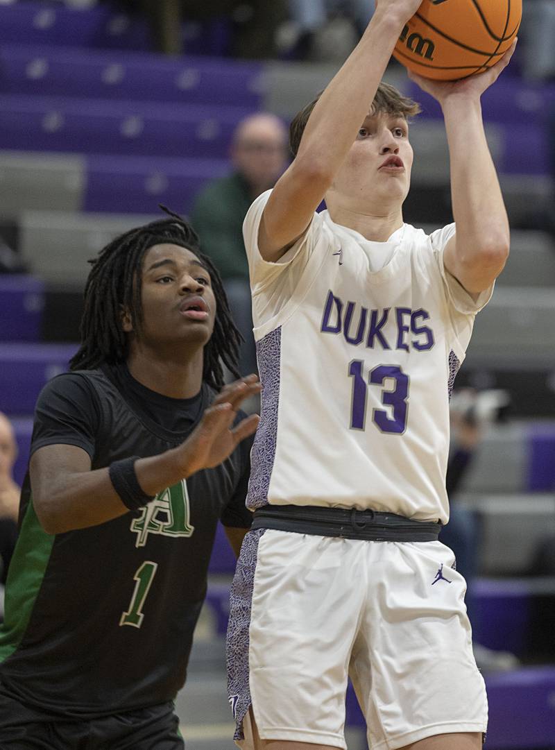 Dixon’s Beckham Rock puts up a shot against Alleman Wednesday, Jan. 28, 2026.