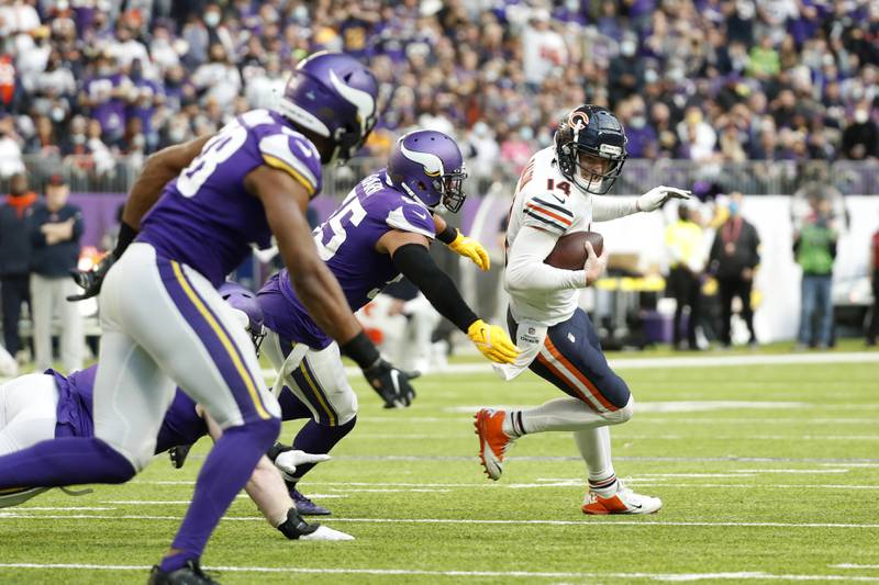 Chicago Bears quarterback Andy Dalton is sacked by Minnesota Vikings outside linebacker Anthony Barr during the second half, Sunday, Jan. 9, 2022, in Minneapolis.
