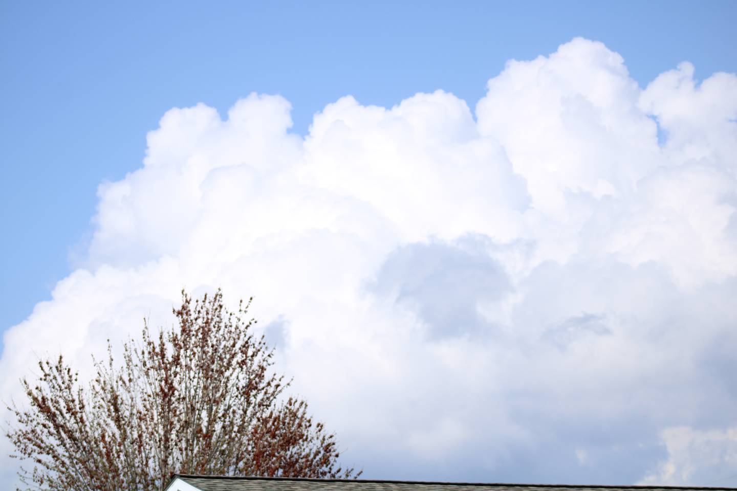 Fluffy, moisture-laden clouds drift across northern Illinois skies on Saturday. The region was under a tornado watch and select areas were under thunderstorm warnings.