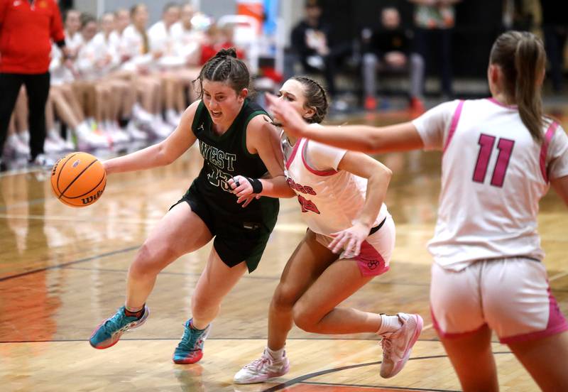 Glenbard West's Makenna Yeager drives toward the basket during the Class 4A St. Charles East Sectional final against Batavia on Thursday, Feb. 27, 2025 in St. Charles.