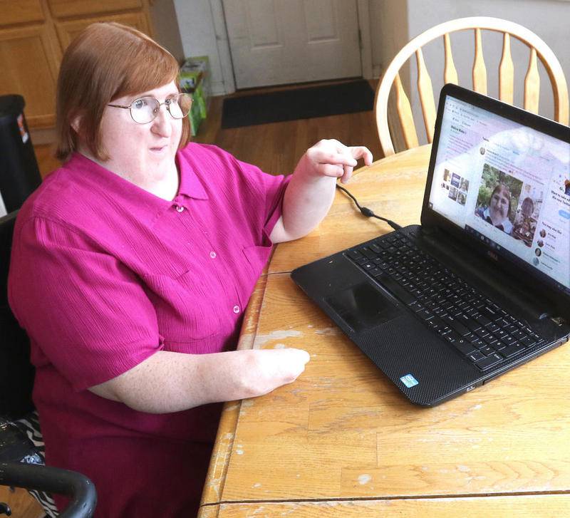 DeKalb native, Northern Illinois University alumna, and local blogger and journalist Melissa Blake, talks at her home in DeKalb Thursday, about her tweet that went viral after she deflected cyberbullies who mocked her appearance following a column she wrote about President Trump.