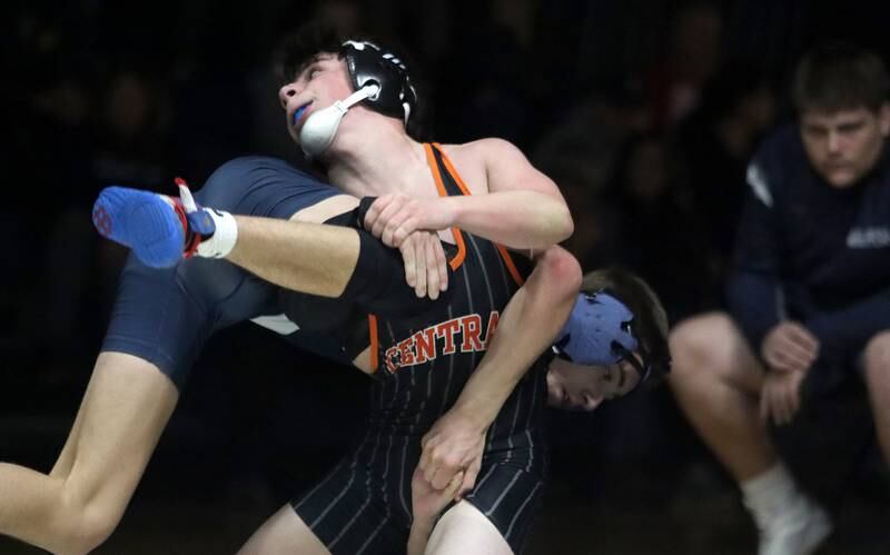 Crystal Lake Central’s Daniel Snow, front, battles Cary-Grove’s Levi Ardente at 132 pounds in varsity wrestling Thursday, Dec. 19, 2024 at Cary-Grove High School in Cary.