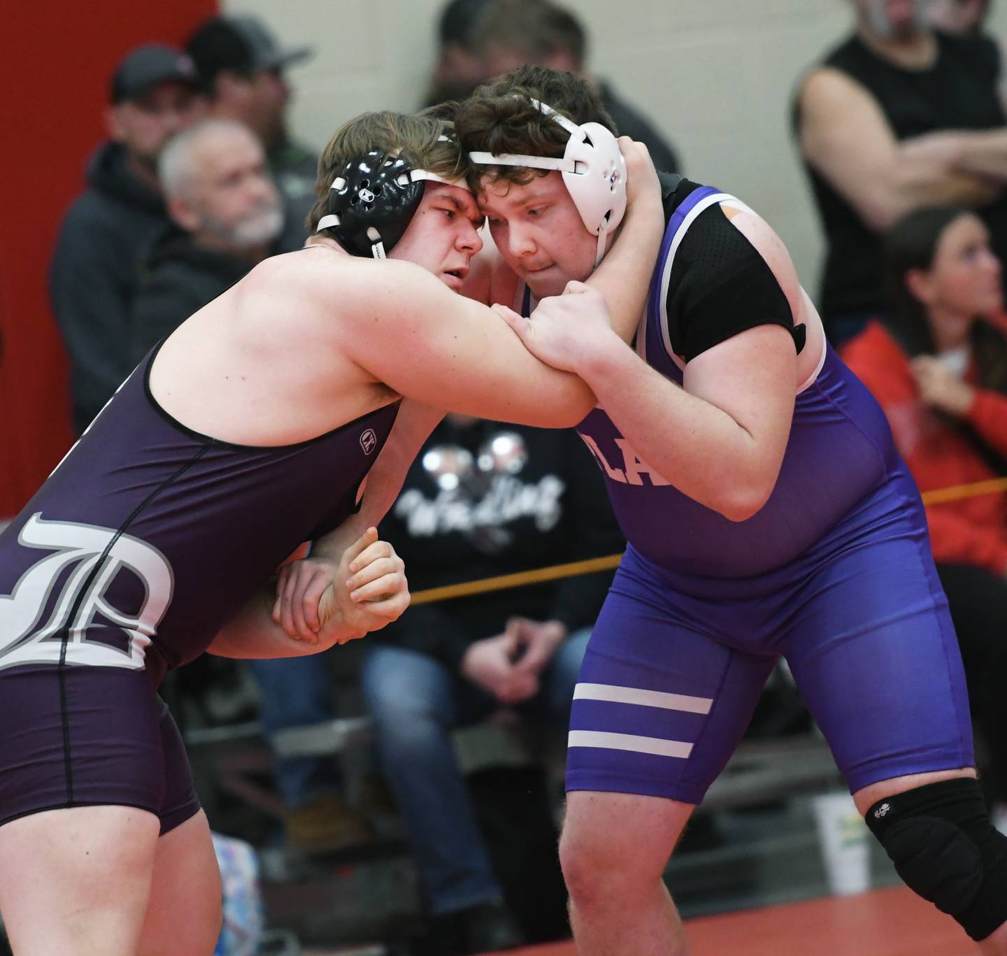 Dixon's Shaun DeVries (left) and Plano's Alex Diaz start their 285-pound match at the 1A Oregon Wrestling Sectional on Friday night.