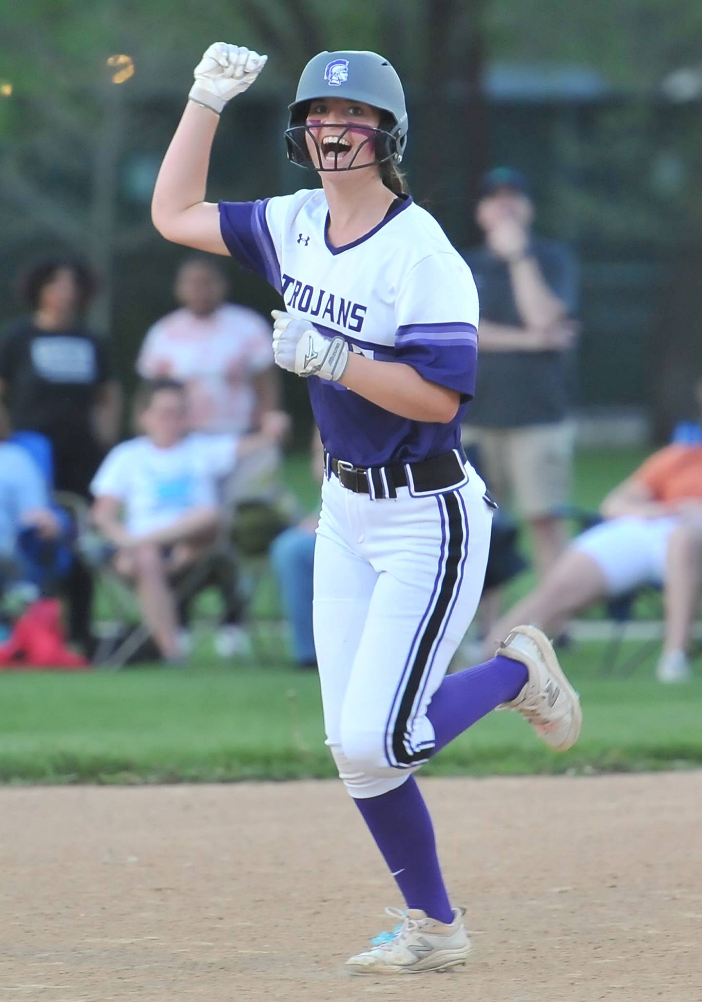 Downers Grove North's Bridget Callaghan rounds the bases after hitting a home run during a game against Downers Grove South on May. 12, 2022 at McCollum Park in Downers Grove.