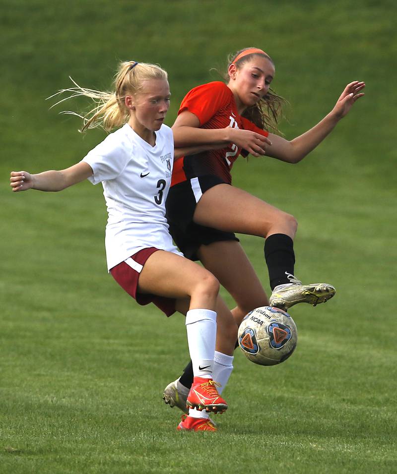 Prairie Ridge's Kaitlyn Gorton battles with Crystal Lake Central's Kali Kaiser for control of the ball during a Fox Valley Conference soccer match Tuesday, May 10, 2022, between Crystal Lake Central and Prairie Ridge at Crystal Lake Central High School.