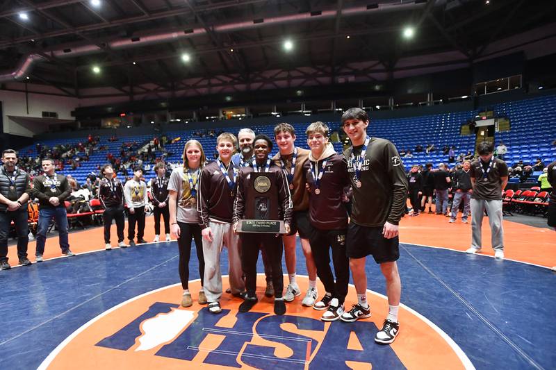 Joliet Catholic captains receive the Class 3A third place trophy at the IHSA Dual Team State Finals on Saturday, March 1.