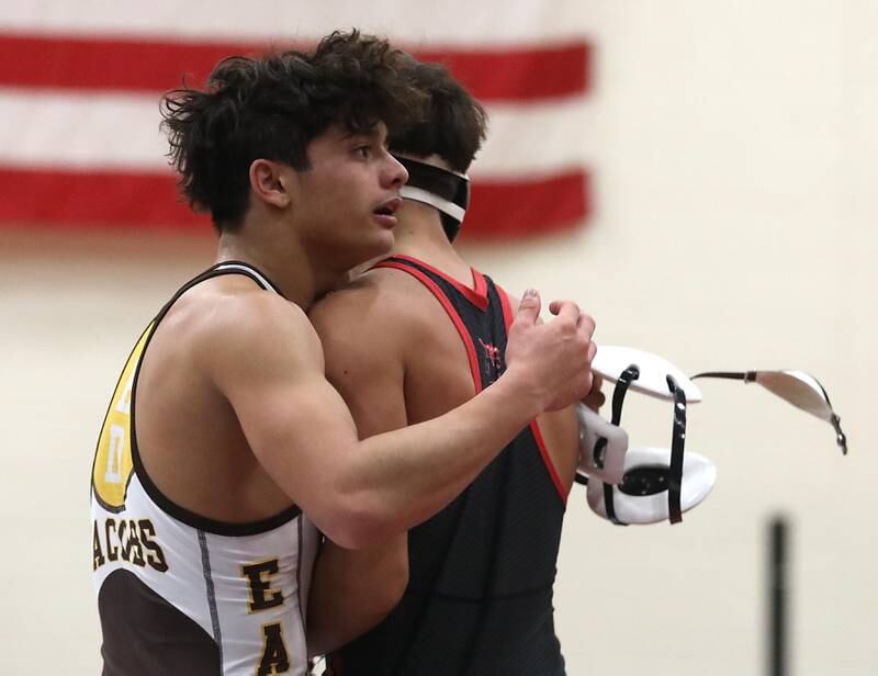 Jacobs’ Enrique Garcia hugs Huntley’s Julian Gutierrez after defeating him in the 132—pound match of a Fox Valley Conference wrestling meet on Thursday, Dec. 11, 2025, at Huntley High School.