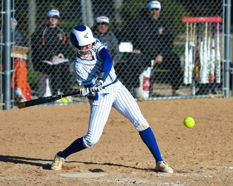 Wheaton North's Reagan Crosthwaite (21) makes contact with the ball and thrown out at first during the game on Friday April 19, 2024, while traveling to take on Wheaton Warrenville South.