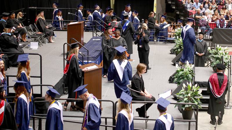 Oswego High School seniors receive their diplomas in the NIU Convocation Center in DeKalb on Saturday, May 21, 2022.