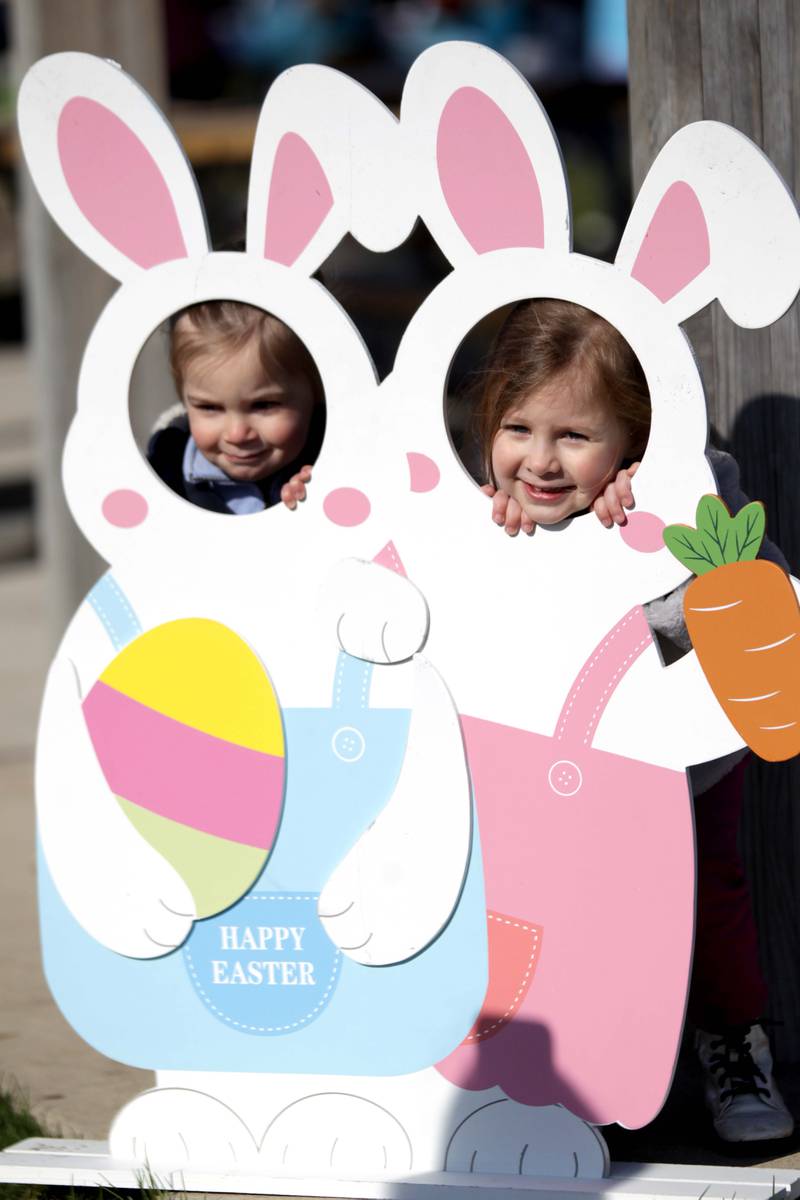 Siblings Miles, 2, and Vera Dilday, 3, of Glen Ellyn pose for a photo during an egg hunt hosted by the Glen Ellyn Park District at Maryknoll Park on Friday, April 7, 2023.