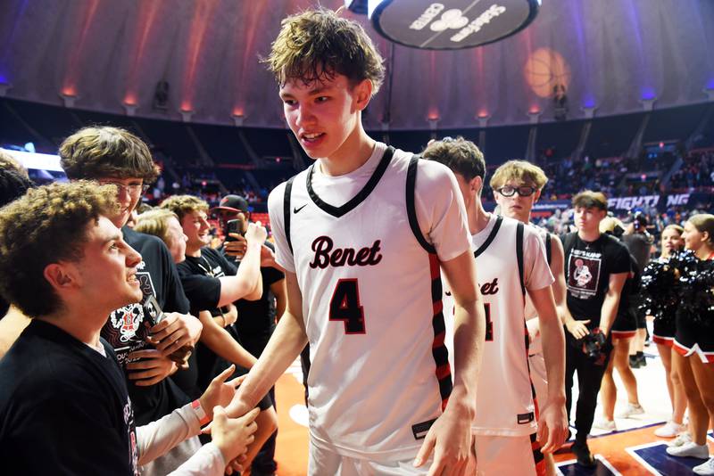 Benet Academy's Daniel Pauliukonis shakes hands with fans after the Redwings defeated Evanston 56-47 during the IHSA Class 4A boys basketball state semifinals at State Farm Center on Friday, March 14, 2025 in Champaign.