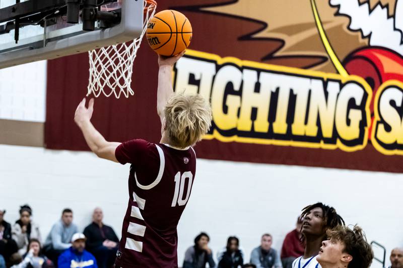 Lockport's Nojus Venckus goes for a layup during a WJOL Thanksgiving Classic Boys Basketball game against Joliet Central at the University of St. Francis’s Pat Sullivan Center in Joliet on Nov. 24, 2025.
