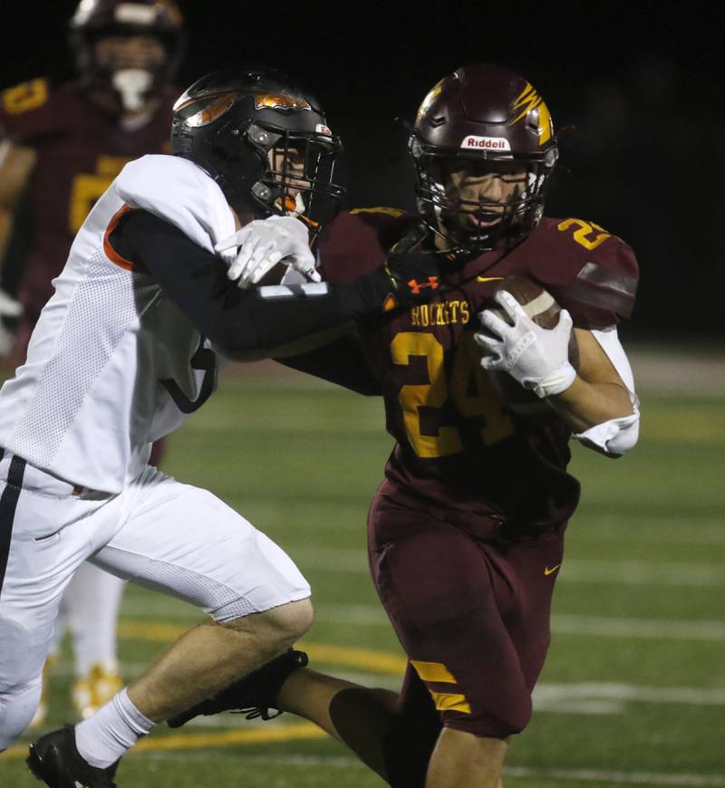 Richmond-Burton's Hunter Carley tries to break the tackle attempt of Sandwich's Cole Leeper during a Kishwaukee River Conference football game on Friday, Oct. 4, 2024, at Richmond-Burton High School.