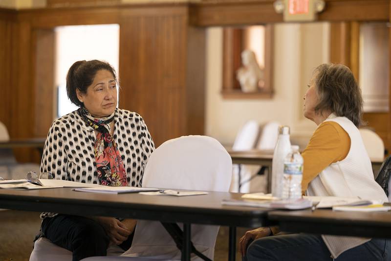 Lydia Saucedo (left) of Sterling and Kathleen Weber of Lanark discuss the first half of the creative writing workshop  Friday, March 3, 2023 at the Lee County Senior Center.