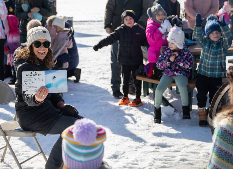 Preschool Teacher Kelly Nielsen reads a story during the Wheaton Park District's Ice-A-Palooza at the Central Athletic Complex in Wheaton on Saturday, Feb. 4, 2023.