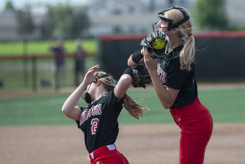 Forreston’s Alaina Miller (left) and Ella Ingram collide a bit making a play against Newark Saturday, June 4, 2022 during the IHSA Class 1A softball state third place game.