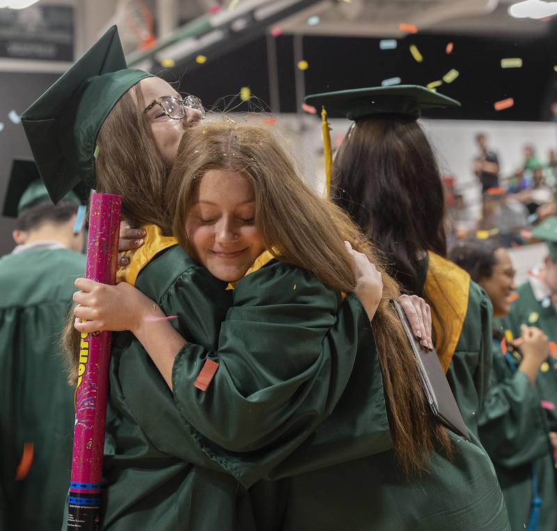 Madilyn Blackburn (right) hugs Marissa Bliefnick Sunday, May 18, 2025, at the end of Rock Falls High School’s commencement.