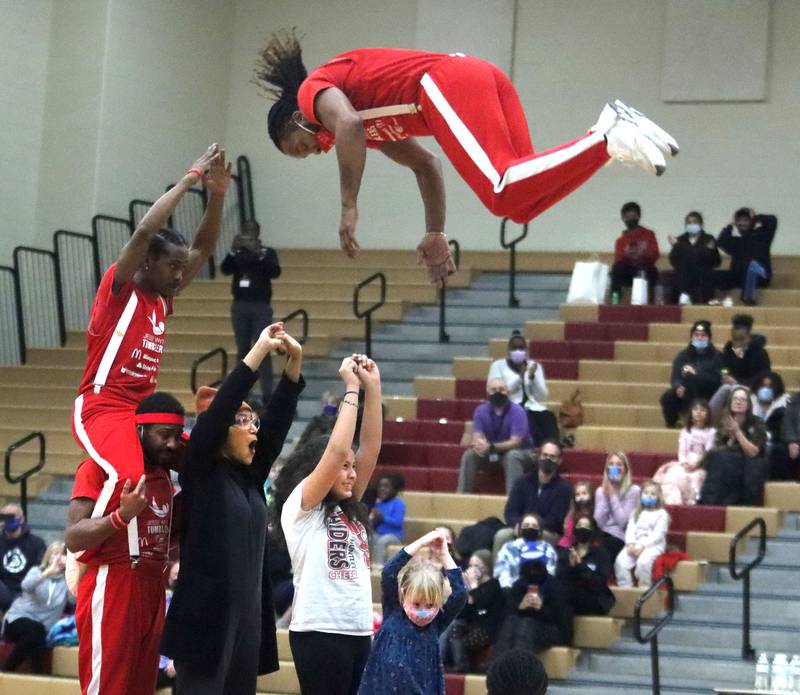 The Jesse White Tumblers leap over audience members during the Black History Month event, titled “Celebrating Black Stories: Narratives on Identity, Belonging and Community.” The event was held Feb. 24, 2022, at Huntley High School.
