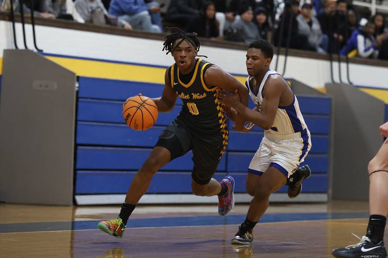 Joliet West’s Aamir Shannon makes a move to the baseline against Joliet Central on Thursday, Jan. 15, 2026 in Joliet.