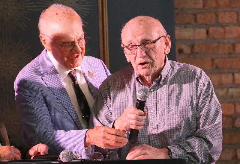 Former Walnut athlete and Bureau Valley coach Ken Bourquin, talks with emcee Lanny Slevin during the 2025 Shaw Media Illinois Valley Sports Hall of Fame at the Auditorium Ballroom in La Salle.
