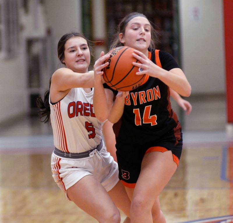 Oregon's Anna Carreno  tries to knock the ball away from Byron's Jaden Palskill during a Wednesday, Jan. 10, 2024 game at the Blackhawk Center in Oregon.