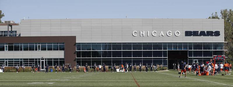 Chicago Bears players warm up and stretch during training camp Sept. 3 at Halas Hall in Lake Forest.