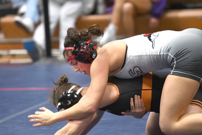 Fulton's Kerby Germann holds Harlem's Madison Heneks to finish first at 130 pounds during the Belvidere Regional on Saturday, Feb. 7, 2026.
