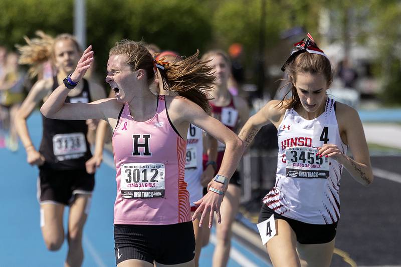 Anna Harden of Hersey reacts to winning the 3A 1600 run just ahead of Hindale’s Catie McCabe Saturday, May 20, 2023 during the IHSA state track and field finals at Eastern Illinois University in Charleston.