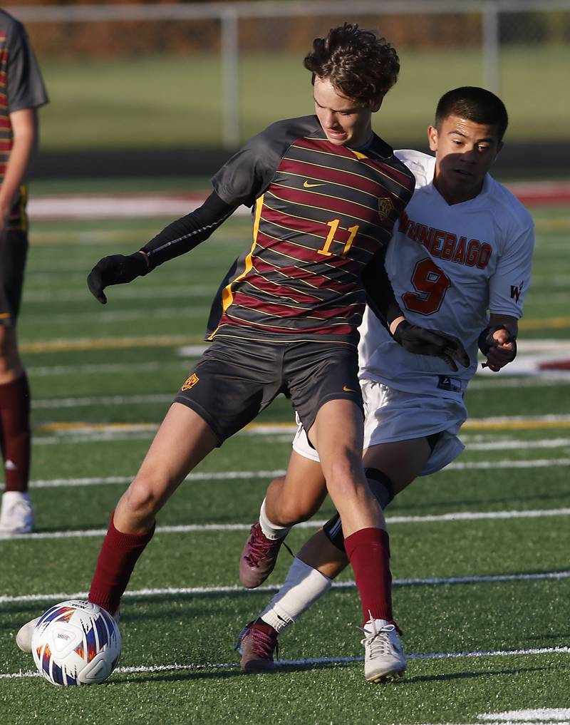 Richmond-Burton's Jack Meyer controls the ball infant of Winnebago's Daniel Guzman during the IHSA Class 1A Richmond-Burton Regional Final soccer match Tuesday, Oct. 17, 2023, at Richmond-Burton High School in Richmond.
