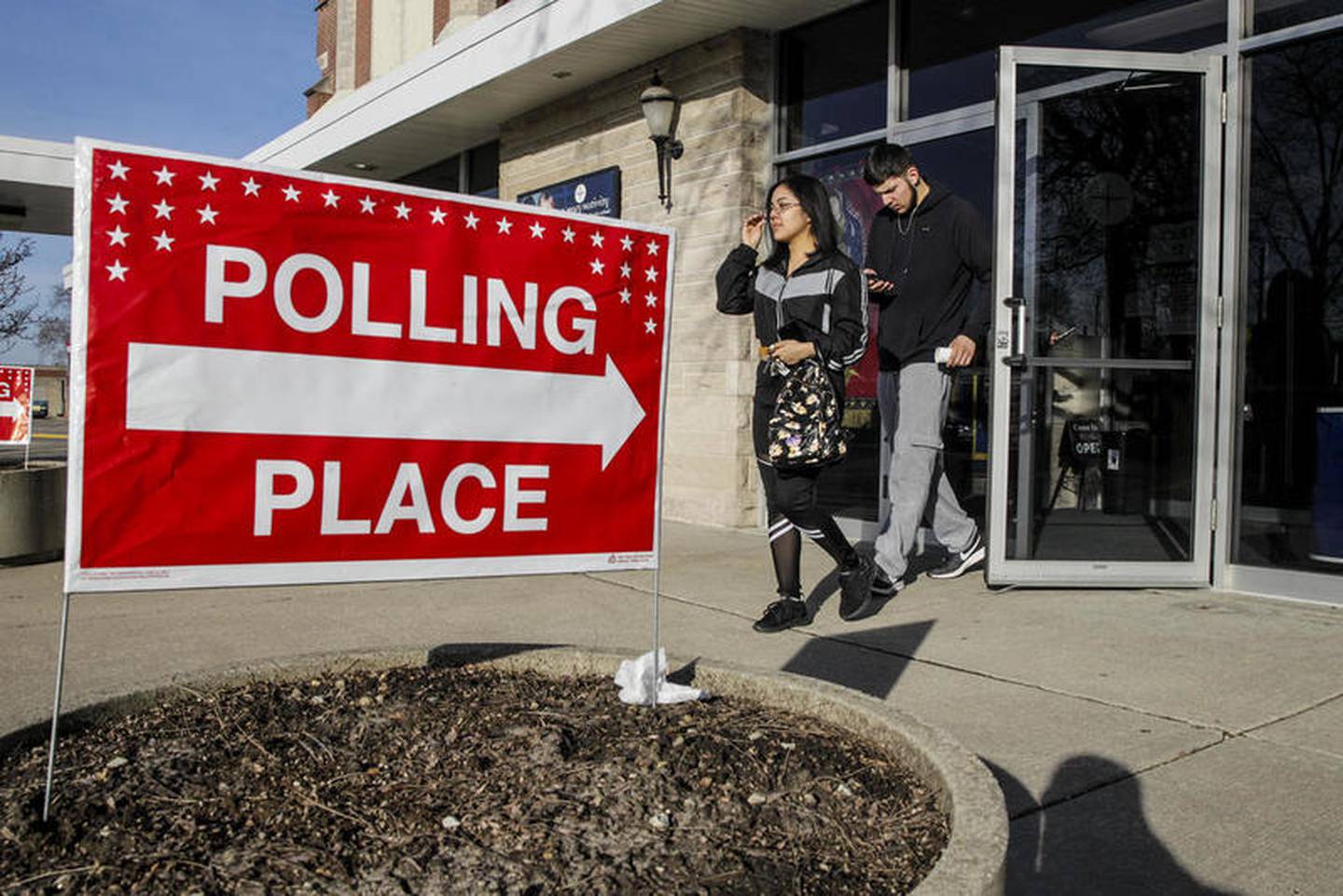 Voters can be seen Tuesday, March 17, 2020, after casting their ballot in Illinois Primary Election at St. Mary Nativity Catholic Church in Joliet, Ill.