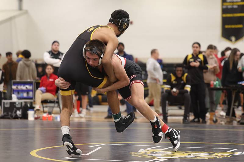 Vincent Konecki of Yorkville drops Adrian Hernandez of Joliet West in the 132-pound weight SPC Conference championship match at Joliet West on Saturday, Jan 25, 2025.