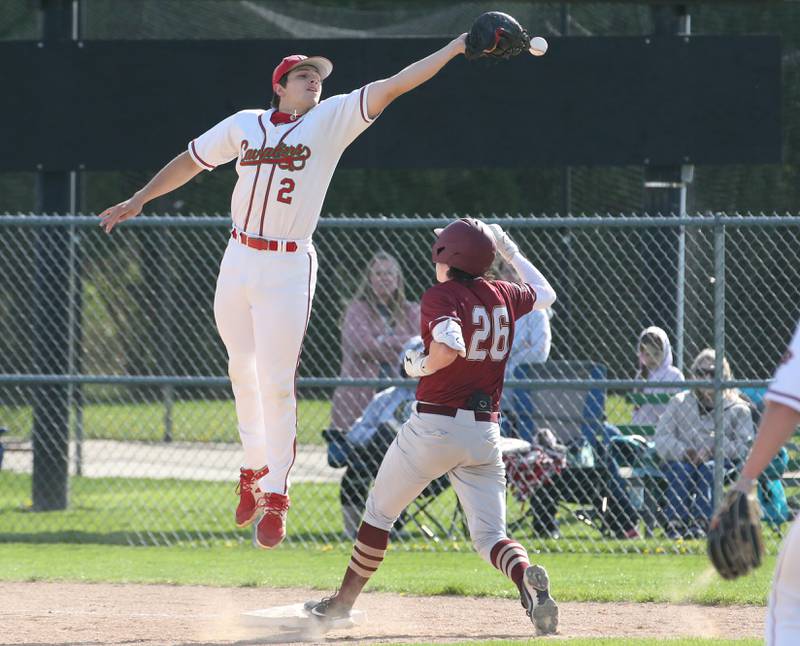 L-Ps first baseman Nolan Van Duzer misses a throw at first base as Morris's Shane Potter is safe at first on Friday, April 21, 2023 at Dickinson Field in Oglesby.