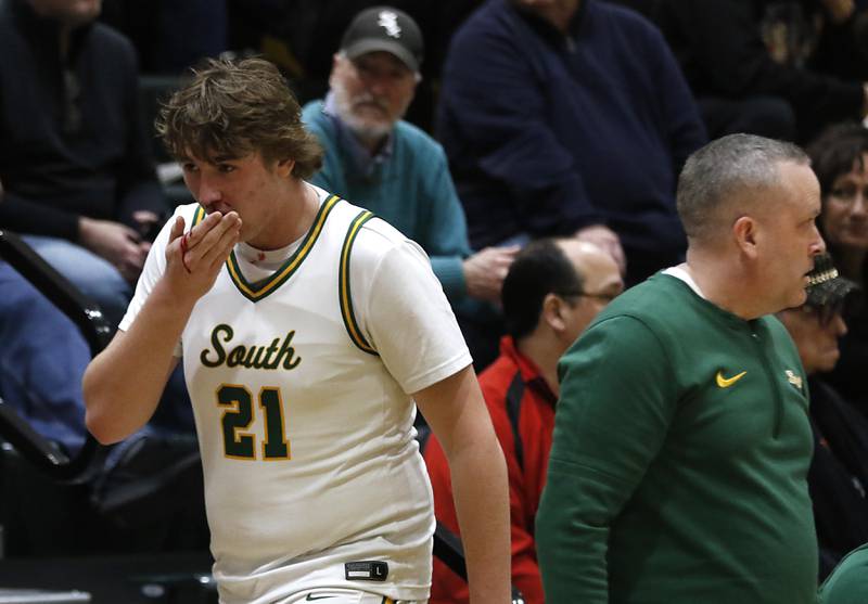 Crystal Lake South's Ryan Morgan walks off the court ask blood runs form his nose during a Fox Valley Conference basketball game against McHenry on Friday, Jan. 31, 2025, at Crystal Lake South High School.