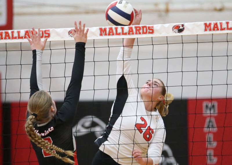 Henry-Senachwine's Brooklynn Thompson sends a kill past Woodland's Ella Derossett on Thursday, Oct. 3, 2024 at Henry-Senachwine High School.