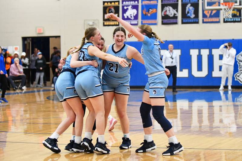 Cissna Park's Addison Lucht, right, joins her teammates in celebrating their 47-35 victory over St. Teresa in the IHSA Class 1A Blue Ridge Super-Sectional on Monday, March 3.