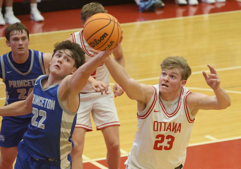 Princeton's Deacon Gutshall and Ottawa's Owen Sanders go after the ball during the Dean Riley Shootin' The Rock Thanksgiving Tournament on Monday Nov. 24, 2025 in Kingman Gymnasium at Ottawa High School.