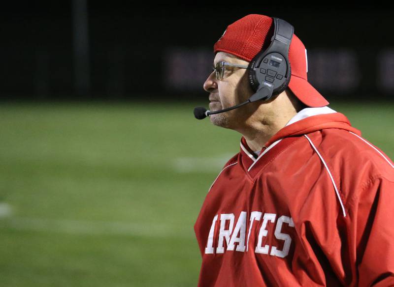 Ottawa football assistant coach Mark Andrews watches the Pirates play from the sidelines on Friday, Oct. 24, 2025 on Kingman Field at Ottawa High School. Andrews is retiring at the end of the school year.