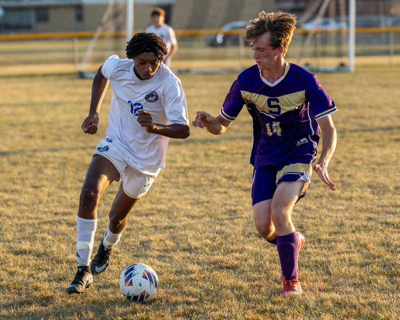 Jackson Brockway (12) of Somonauk/Leland/Newark dribbles ball forward as Caleb Collins (14) of Serena trails on Monday, Sept. 29, 2025, at Serena High School in Serena.
