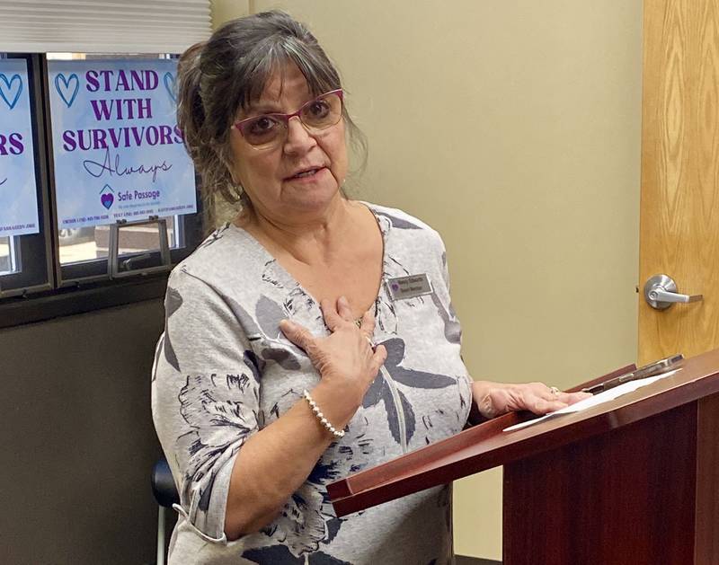 Safe Passage Inc. Board of Directors member Nancy Edwards speaks about surviving domestic violence and seeking help with her children at Safe Passage years ago. Now as a board member, she said she wants to help others like her. Safe Passage held a ceremonial groundbreaking on Friday, Dec. 5, 2025, for its new facility on Frankling Street, expected to undergo construction starting in the spring.