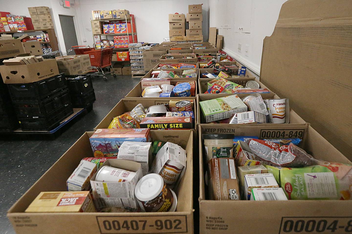 A line of food extends the length of the Illinois Valley Food Pantry on Wednesday, Nov. 30, 2022 in La Salle.