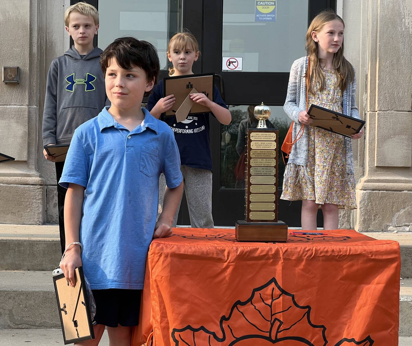Harrison Rowland, 8, of Sycamore, was announced as the 2023 Sycamore Pumpkin Festival theme contest winner for his entry "Pumpkins of History," on Wednesday, May 17, 2023 outside the DeKalb County Courthouse, 133 W. State St., in Sycamore. Harrison Rowland's mother, Sarah Rowland was also a contest winner in 1997 with her entry "Pumpkin Fiesta."