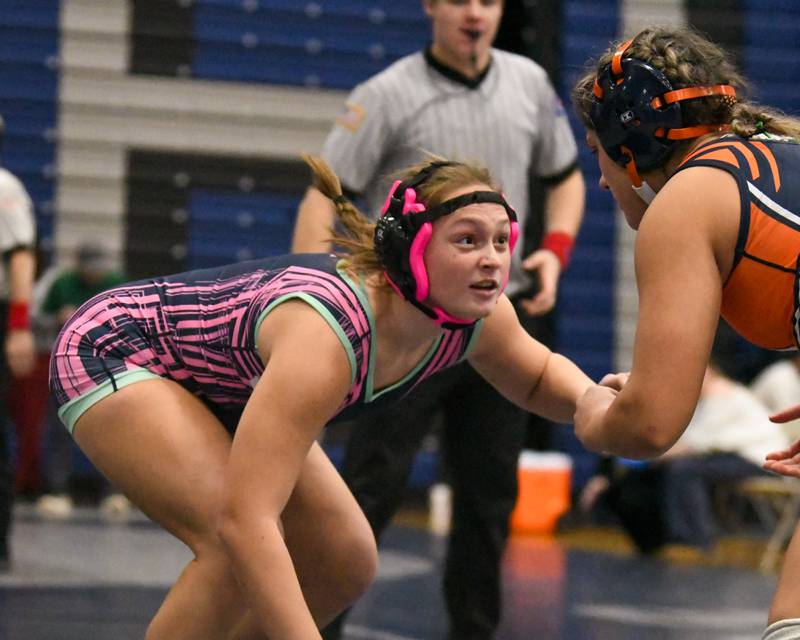 Brianna Crown of Woodstock keeps her focus while taking on Kiyah Chavez of Oswego in the155-weight class during the championship match where Kiyah took the win with a pin over Brianna during the Aaron Dundley invite held at Oswego East High School.