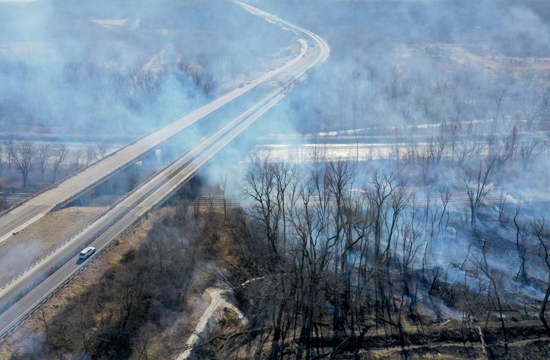 A large brush fire burns where Interstate 180 intersects with the Hennepin Canal on Tuesday, Feb. 10, 2026 near Princeton. A Mutual Aid Box Alarm (MABAS) was dispatched around 12:30p.m. Bureau County Fire departments from Bureau, Ladd, Wyanet, Princeton, Hennepin and others assisted with the brush fire.