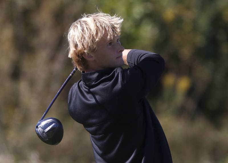 McHenry’s Dane Currie watches his tee shot in the seventh hole during the IHSA Class 3A Jacobs Sectional golf tournament on Monday, Oct. 7, 2024, at Randall Oaks Golf Club in West Dundee.