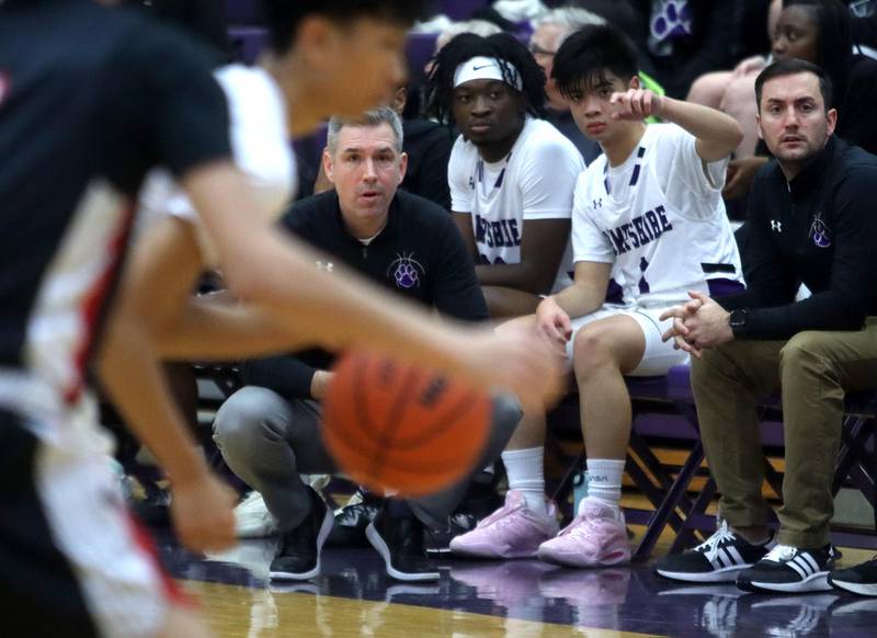Hampshire’s coach Mike Featherly keeps an eye on action against Huntley in boys basketball at Hampshire on Friday.