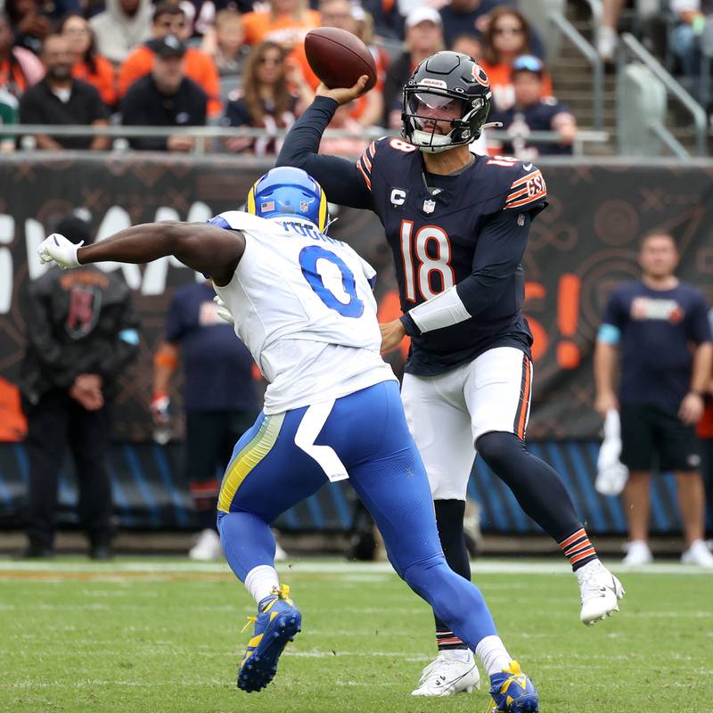 Chicago Bears quarterback Caleb Williams throws a pass over Los Angeles Rams linebacker Byron Young during their game Sunday, Sept. 29, 2024, at Soldier Field in Chicago.