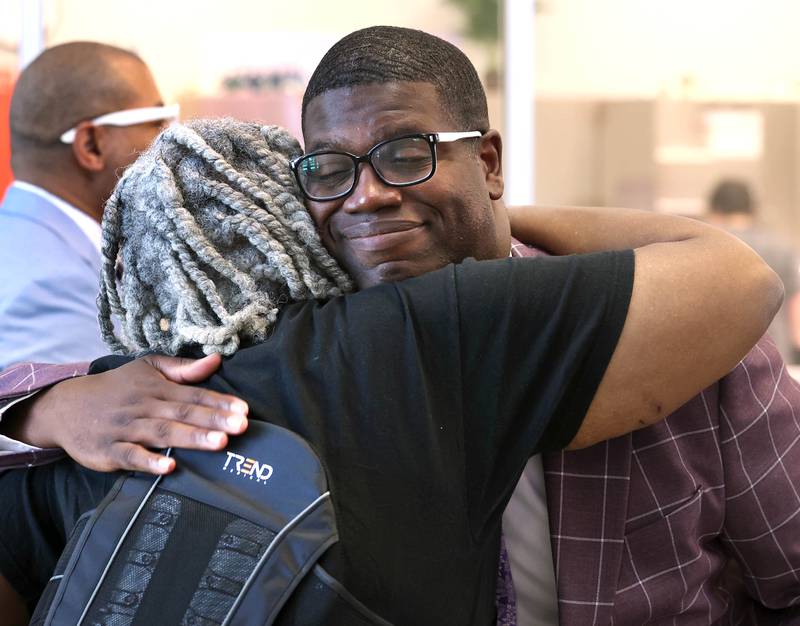 Mitchell Elementary School Principal Maurice McDavid greets his mom Jeanetta McDavid Friday, Aug. 8, 2025, during the grand opening celebration for the new Dr. Leroy A. Mitchell Elementary School in DeKalb.