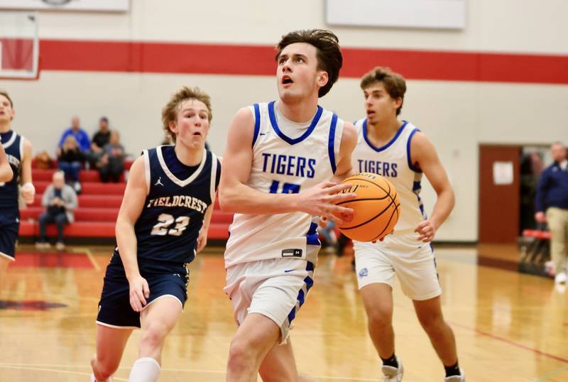 Princeton's Gavin Lanham takes in a layup against Fieldcrest Tuesday night at Hall High School.